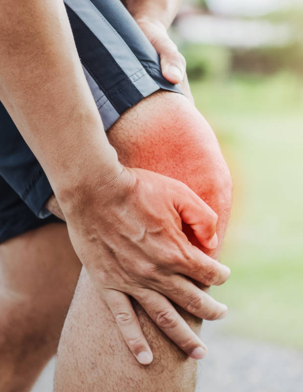 runner sport with running knee injury at park